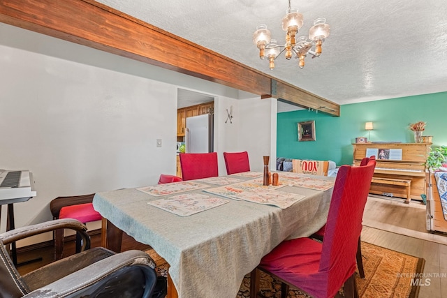 4 N 100 W, Fairfield, ID 83327 - dining space with a chandelier, a textured ceiling, and hardwood / wood-style floors