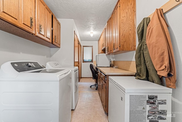4 N 100 W, Fairfield, ID 83327 - laundry room featuring cabinet space, washing machine and dryer, a textured ceiling, and light tile patterned floors