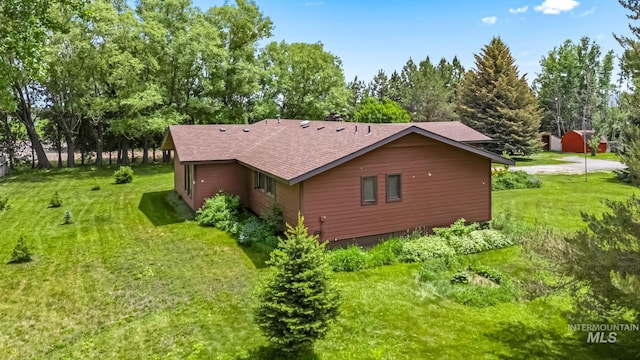 4 N 100 W, Fairfield, ID 83327 - view of home's exterior with a yard, roof with shingles, and view of scattered trees