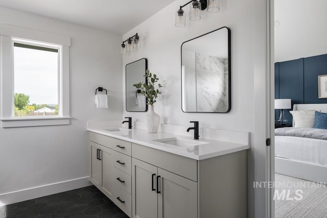 2005 W Freya Ct, Eagle, ID 83616 - ensuite bathroom with baseboards, tile patterned flooring, and double vanity