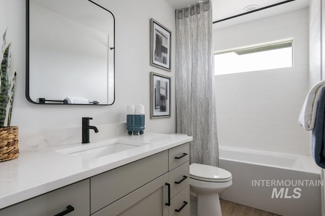 2005 W Freya Ct, Eagle, ID 83616 - bathroom featuring vanity, wood finished floors, toilet, and shower / tub combo with curtain