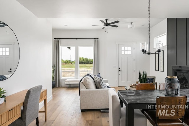 2005 W Freya Ct, Eagle, ID 83616 - living area with ceiling fan, light wood-type flooring, a chandelier, and baseboards
