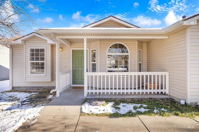 doorway to property featuring a porch