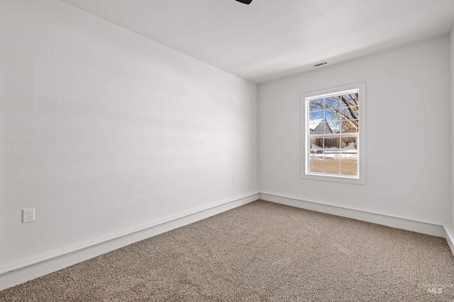 empty room featuring carpet floors