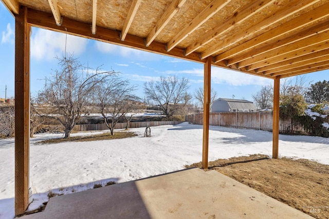 view of yard layered in snow