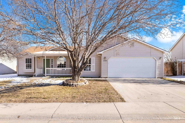 single story home with a garage and a porch