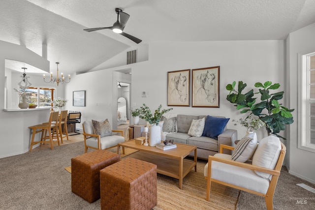 carpeted living room with vaulted ceiling, ceiling fan with notable chandelier, and a textured ceiling