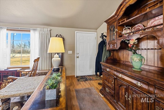 interior space with wood finished floors and baseboards