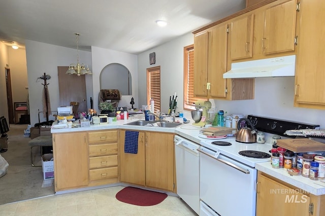 3075 Galey St, Weiser, ID 83672 - kitchen featuring under cabinet range hood, white appliances, a peninsula, a sink, and light countertops