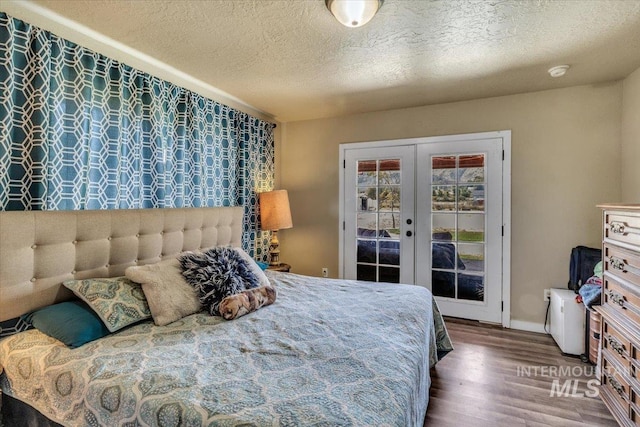 3976 Ranch Ln, Emmett, ID 83617 - bedroom with wood finished floors, access to exterior, french doors, baseboards, and a textured ceiling