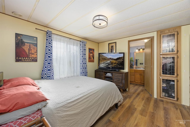 104 Poverty Ln, West Magic, ID 83352 - bedroom with wood finished floors and ensuite bathroom