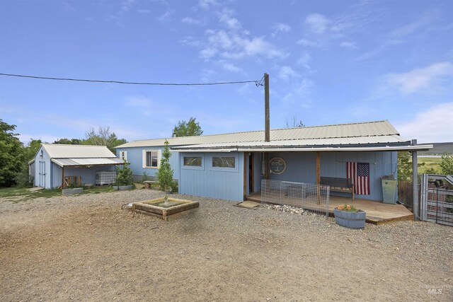 104 Poverty Ln, West Magic, ID 83352 - view of front facade featuring a metal roof and a shed