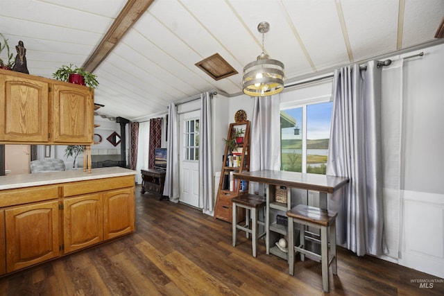 104 Poverty Ln, West Magic, ID 83352 - kitchen with lofted ceiling, dark wood-type flooring, a chandelier, light countertops, and pendant lighting