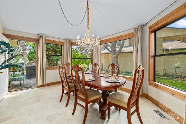 dining area featuring a chandelier