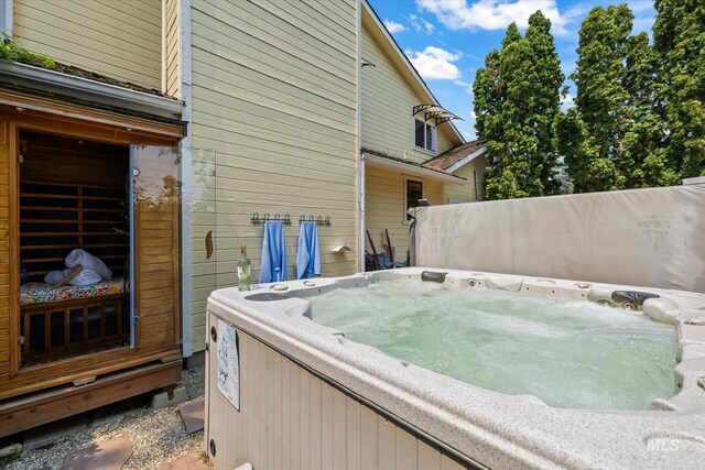 view of patio / terrace with a hot tub