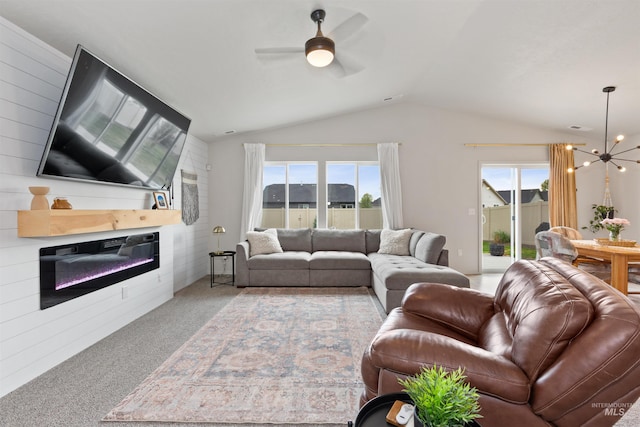 8408 E Dutchman St, Nampa, ID 83687 - living area with a glass covered fireplace, lofted ceiling, plenty of natural light, a ceiling fan, and carpet