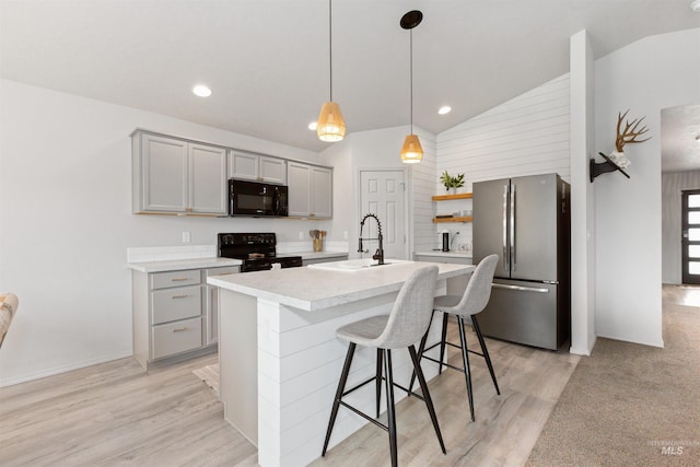 8408 E Dutchman St, Nampa, ID 83687 - kitchen featuring gray cabinetry, light countertops, a sink, black appliances, and lofted ceiling
