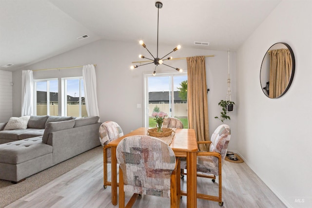 8408 E Dutchman St, Nampa, ID 83687 - dining space with an inviting chandelier, lofted ceiling, visible vents, and light wood-type flooring