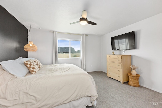 8408 E Dutchman St, Nampa, ID 83687 - bedroom featuring baseboards, ceiling fan, and light carpet