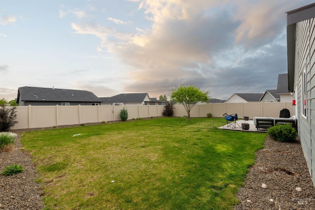8408 E Dutchman St, Nampa, ID 83687 - view of yard featuring a fenced backyard and a patio area