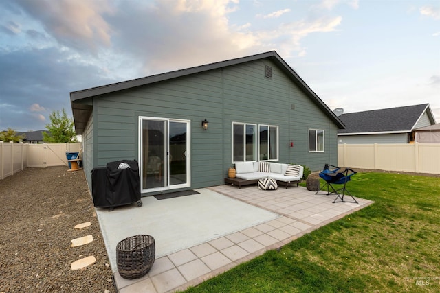8408 E Dutchman St, Nampa, ID 83687 - back of property with a yard, outdoor lounge area, a fenced backyard, and a patio area
