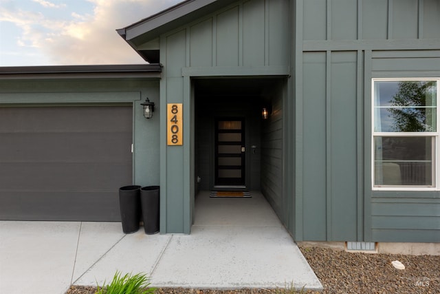 8408 E Dutchman St, Nampa, ID 83687 - doorway to property featuring a garage and board and batten siding