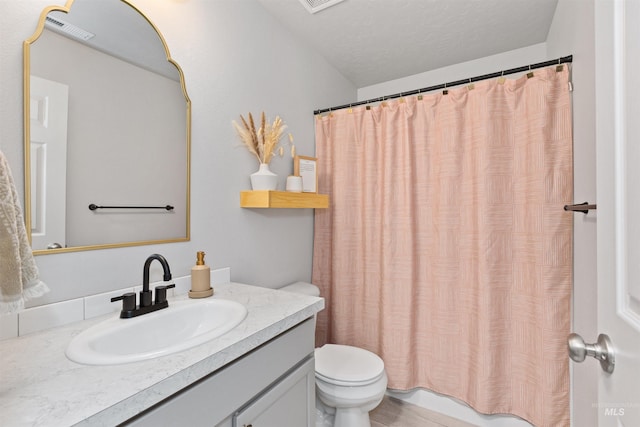 8408 E Dutchman St, Nampa, ID 83687 - full bath featuring vanity, a shower with shower curtain, toilet, and visible vents