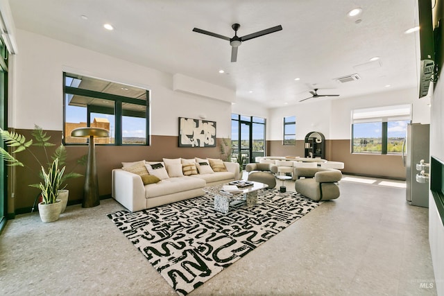 living area with visible vents, recessed lighting, and ceiling fan