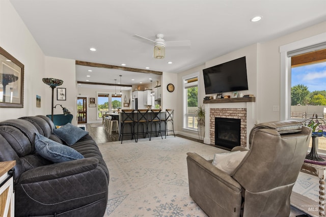 894 Main St, Star, ID 83669 - living room featuring plenty of natural light, ceiling fan, a brick fireplace, and recessed lighting