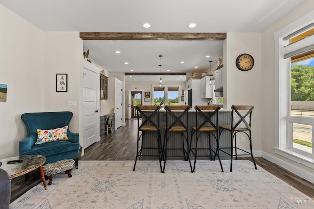 894 Main St, Star, ID 83669 - kitchen featuring a kitchen bar, wood finished floors, freestanding refrigerator, white cabinets, and recessed lighting