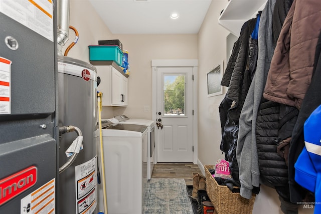 894 Main St, Star, ID 83669 - laundry area featuring independent washer and dryer, water heater, wood finished floors, cabinet space, and heating unit