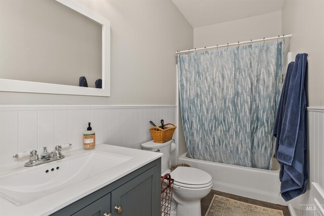 894 Main St, Star, ID 83669 - bathroom with shower / bath combo with shower curtain, vanity, a wainscoted wall, and tile patterned floors