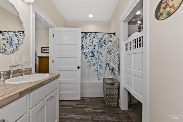 894 Main St, Star, ID 83669 - full bathroom featuring vanity, wood finished floors, shower / bath combo with shower curtain, and recessed lighting