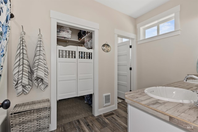 894 Main St, Star, ID 83669 - bathroom featuring wood finished floors and double vanity