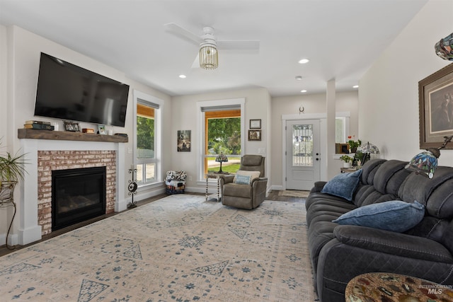 894 Main St, Star, ID 83669 - living room featuring ceiling fan, a brick fireplace, recessed lighting, and wood finished floors