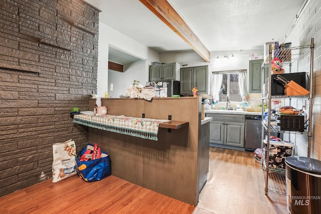 909 Victoria Ave, Fruitland, ID 83619 - kitchen with light wood-style flooring, beam ceiling, dishwasher, a sink, and gray cabinets