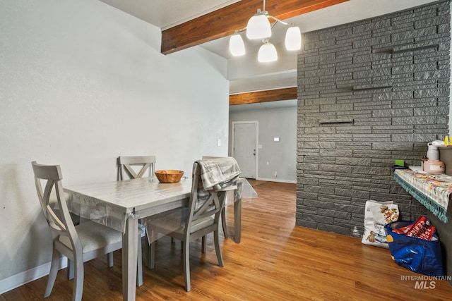 909 Victoria Ave, Fruitland, ID 83619 - dining room with beamed ceiling, wood finished floors, and baseboards