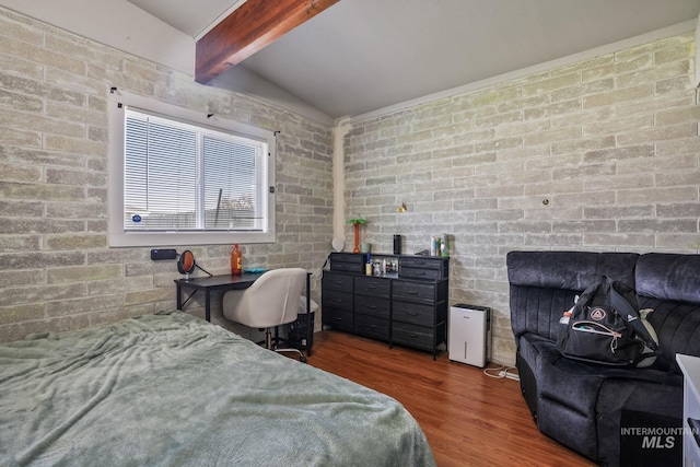 909 Victoria Ave, Fruitland, ID 83619 - bedroom with wood finished floors and brick wall