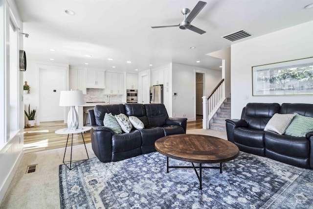 5916 S Wayland Way, Meridian, ID 83642 - living room with a ceiling fan, recessed lighting, stairs, baseboards, and light wood-type flooring