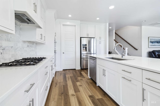 5916 S Wayland Way, Meridian, ID 83642 - kitchen featuring a sink, stainless steel appliances, recessed lighting, light countertops, and white cabinets