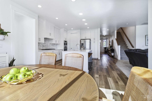 5916 S Wayland Way, Meridian, ID 83642 - dining space featuring stairway, dark wood-style floors, and recessed lighting