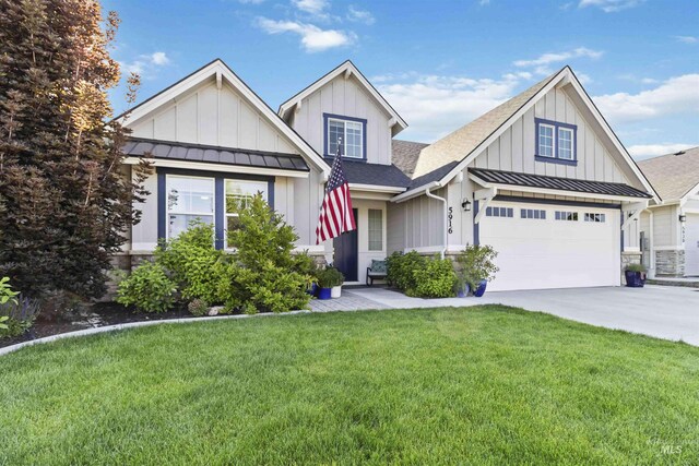 5916 S Wayland Way, Meridian, ID 83642 - view of front of property featuring board and batten siding, a standing seam roof, a shingled roof, and a front yard