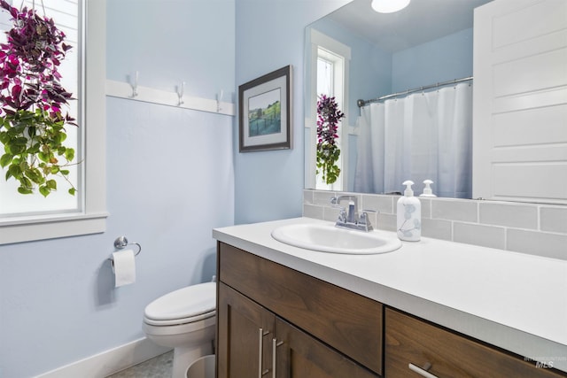 5916 S Wayland Way, Meridian, ID 83642 - full bathroom featuring vanity, toilet, baseboards, and a shower with curtain