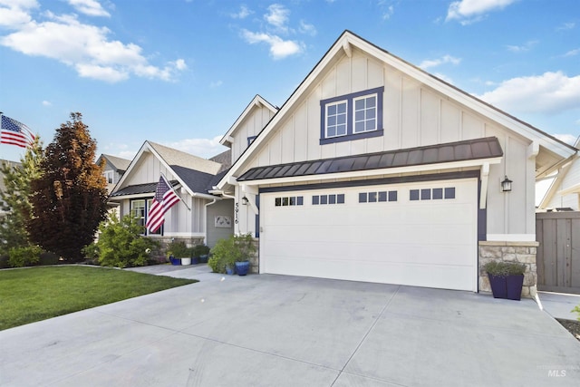5916 S Wayland Way, Meridian, ID 83642 - craftsman inspired home featuring board and batten siding, a standing seam roof, stone siding, driveway, and a garage