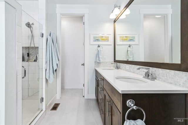 5916 S Wayland Way, Meridian, ID 83642 - full bathroom featuring double vanity, a stall shower, baseboards, and tile patterned floors
