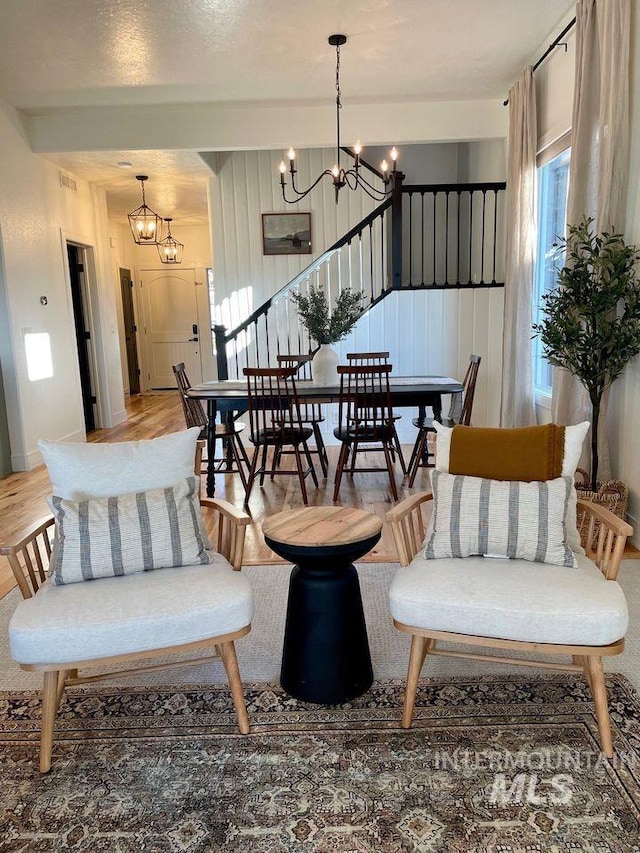 interior space with a notable chandelier and hardwood / wood-style flooring