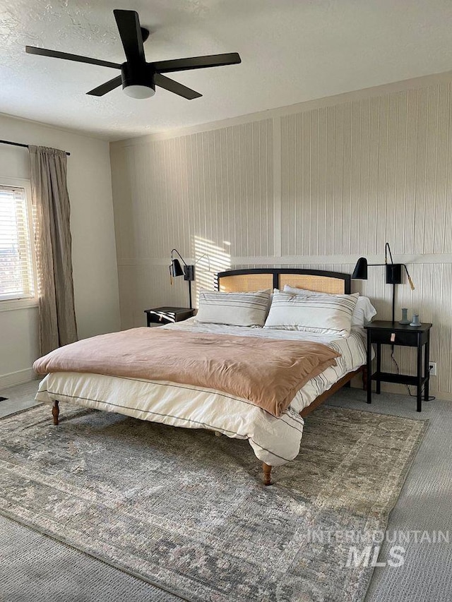 carpeted bedroom with ceiling fan