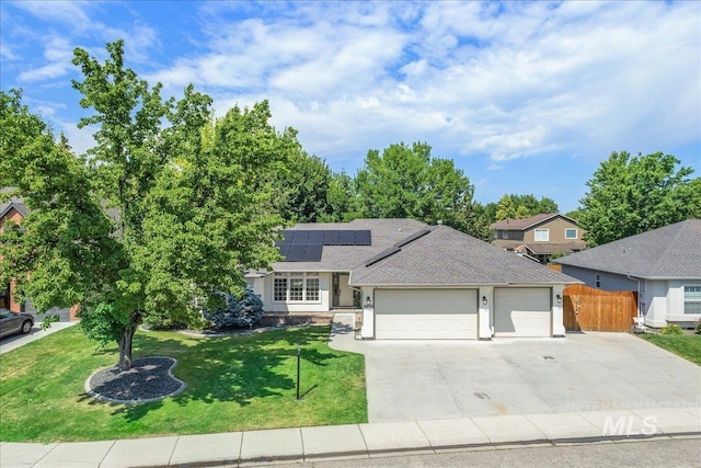 4975 N Morninggale Way, Boise, ID 83713 - view of front facade featuring an attached garage, roof mounted solar panels, and concrete driveway