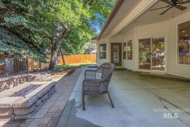 4975 N Morninggale Way, Boise, ID 83713 - fenced backyard with a patio area, a fire pit, and ceiling fan