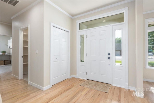 4975 N Morninggale Way, Boise, ID 83713 - entryway featuring light wood-style floors, healthy amount of natural light, and crown molding